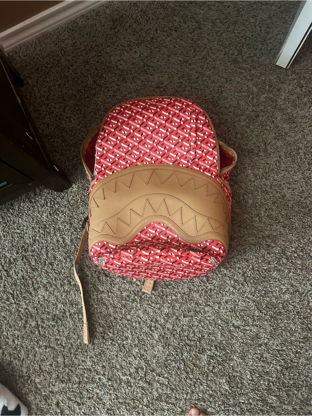 Sprayground Red Patterned Backpack with Tan Accent Panel